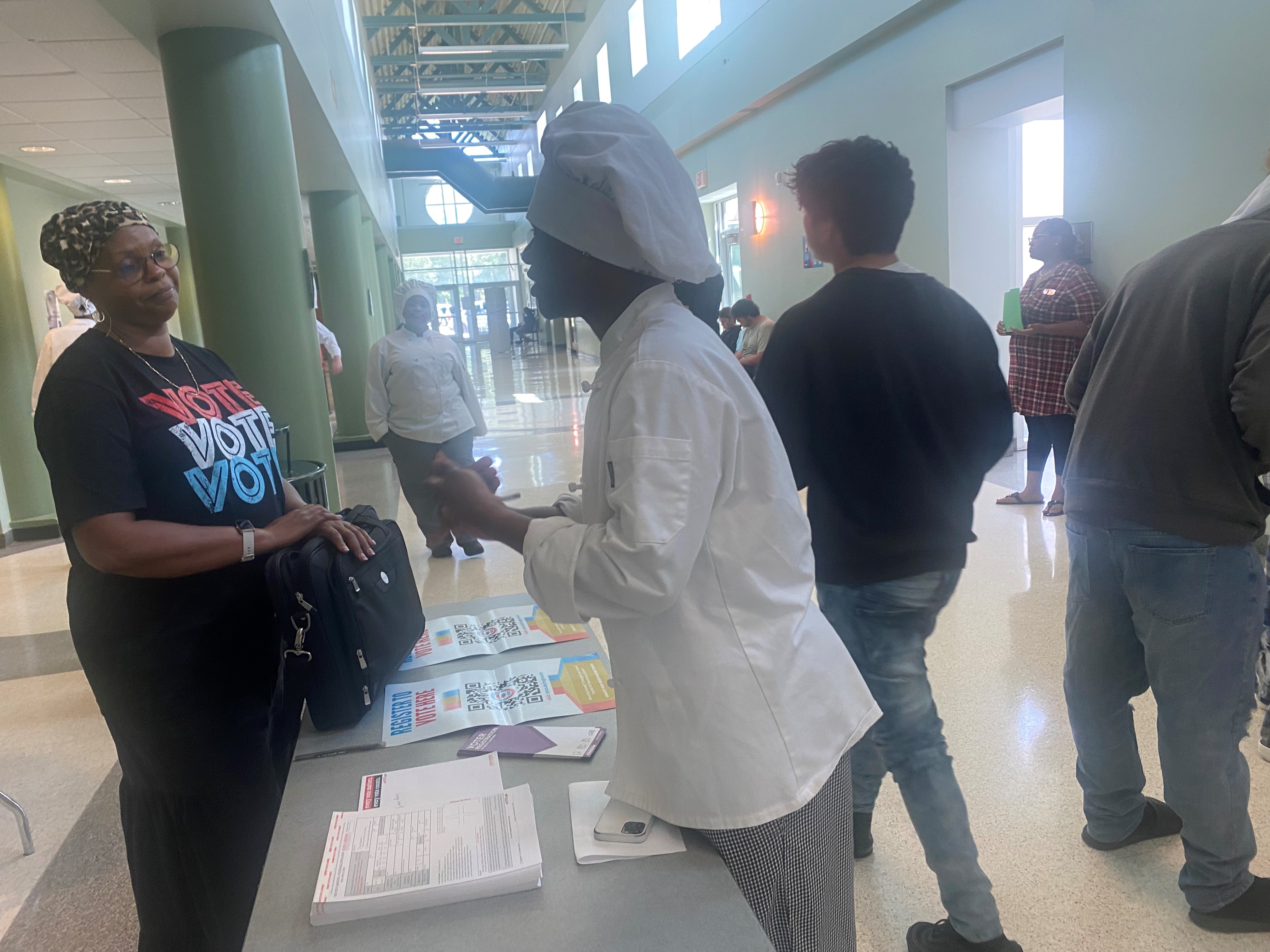 Student from FE Dubose talking to a Voter Registration representative
